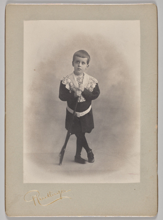 Untitled young boy with lace collar and toy rifle by Reutlinger Studios (French, active 1850s-1937) - Classic Art canvas print