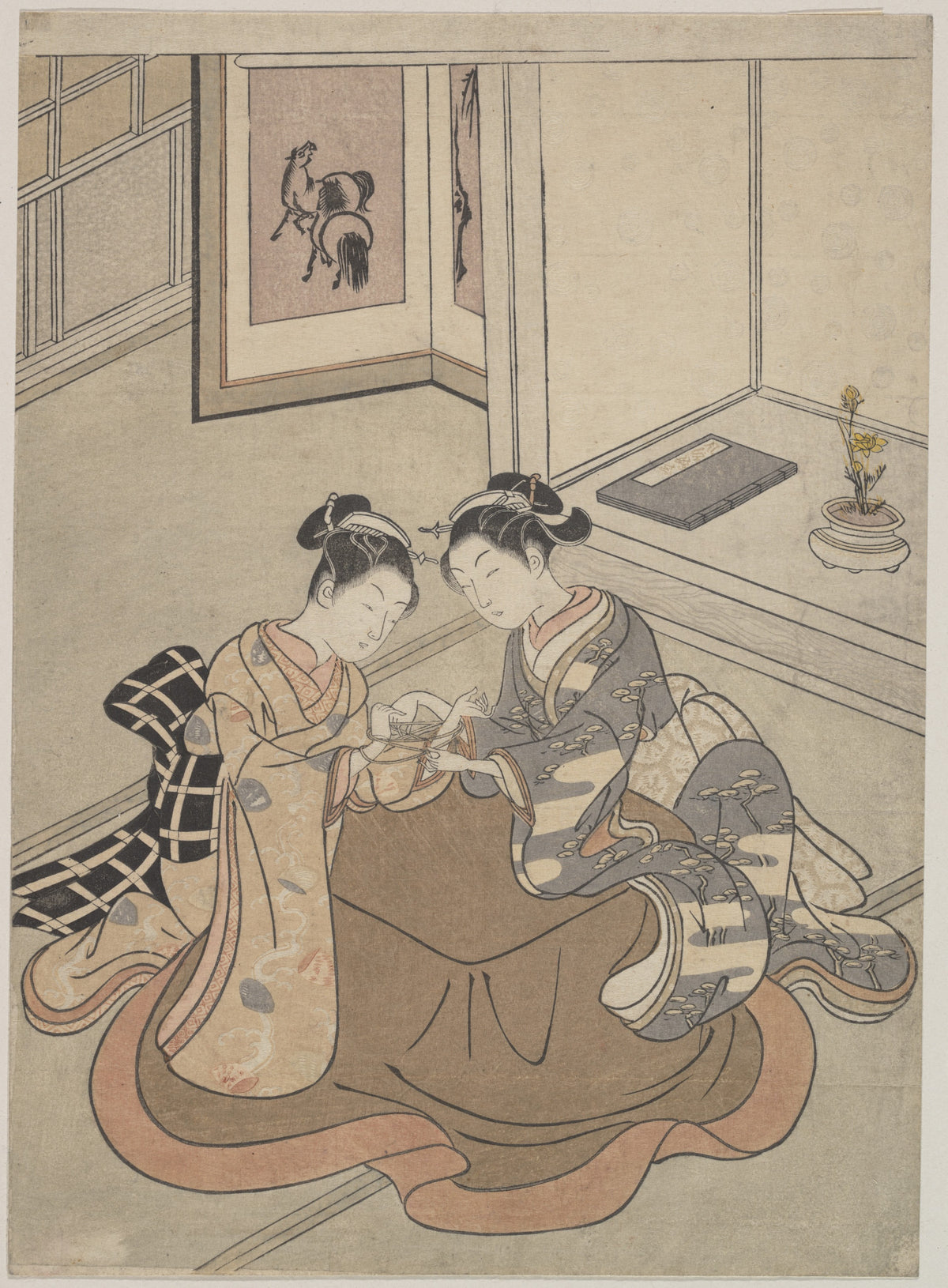 Two Young Women Seated by a Kotatsu Playing Cat's Cradle by Suzuki Harunobu - Ukiyo-e canvas print